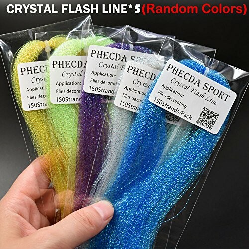 Hand holding packs of crystal flash line in various colors.