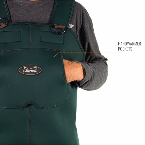 Person wearing fishing waders with handwarmer pockets.