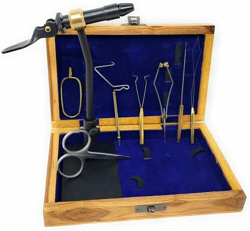 Fly tying kit with tools in a wooden box.